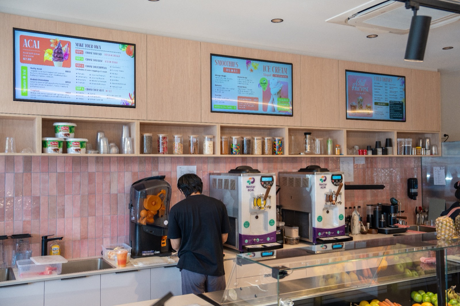 The café counter and menu board at Harvest Lane Mareeba
