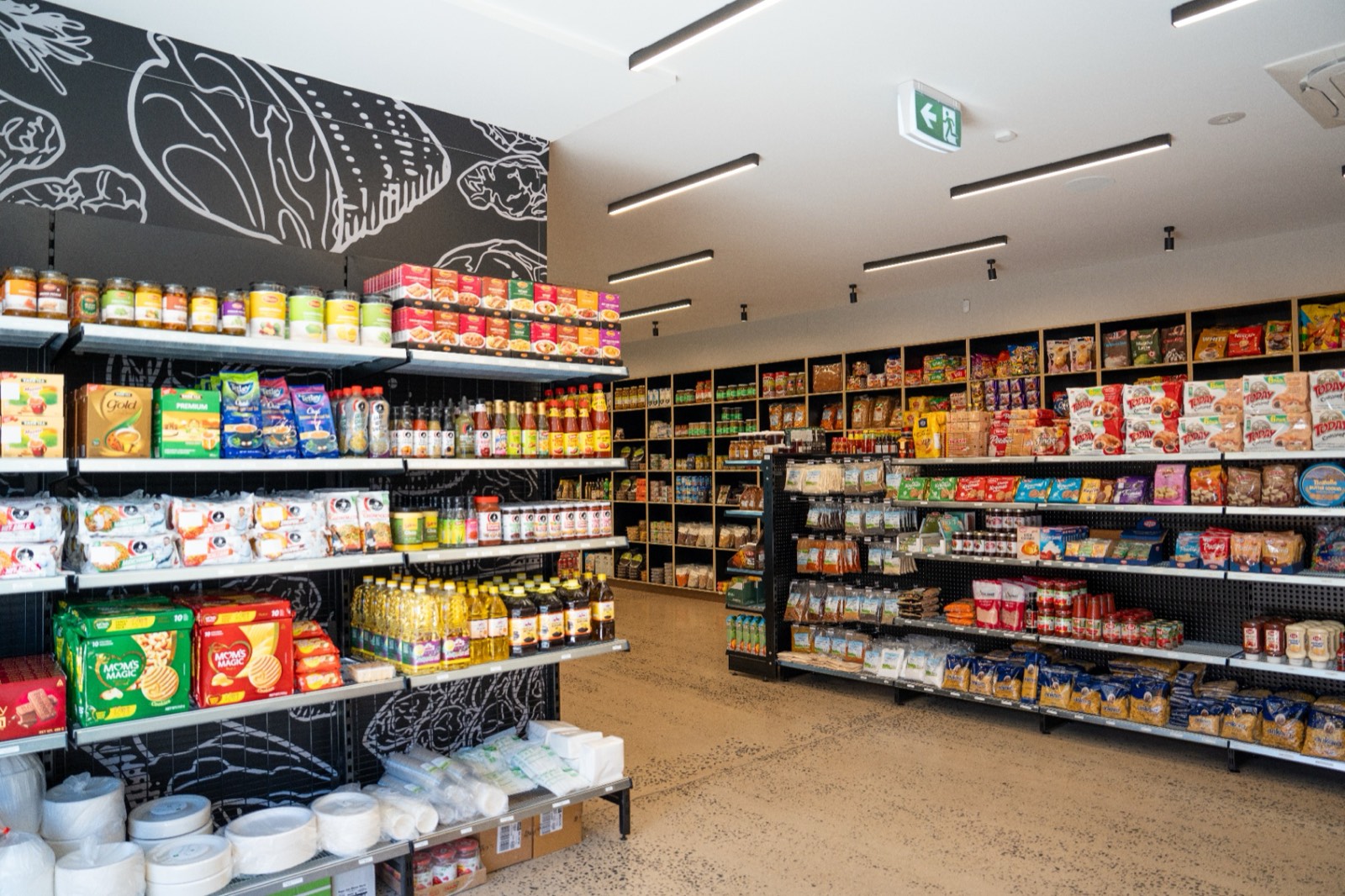 Pantry aisle at Harvest Lane Mareeba, stocked with imported sauces, spices, grains and preserves